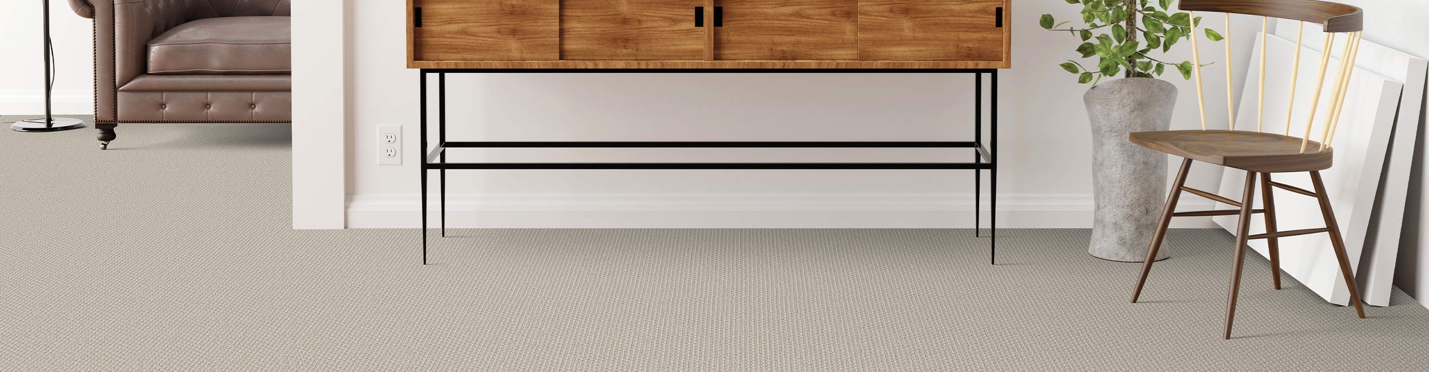 grey carpet in living room area with table