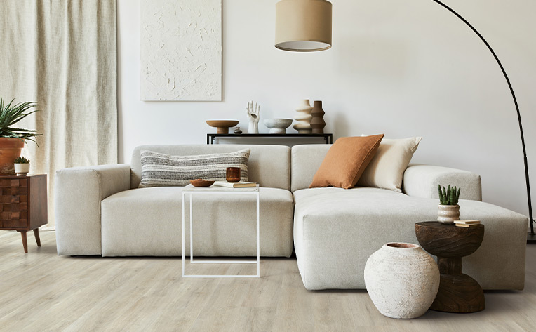 light toned vinyl plank flooring in warm minimalist living room